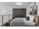 Comfortable bedroom with neutral tones, a large closet and bench at 1601 Park Ave # 112, Denver, CO 80218