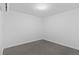 Minimalist bedroom with clean white walls and modern ceiling lighting offers a serene space at 1601 Park Ave # 112, Denver, CO 80218