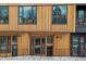 Striking building exterior with eye-catching wood and black accents and secure entrances at 1601 Park Ave # 112, Denver, CO 80218