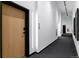 Hallway with sleek black trim, modern lighting, and a neutral color scheme exudes contemporary elegance at 1601 Park Ave # 112, Denver, CO 80218