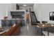 Open-concept living space with a kitchen bar, dining area, and living room at 1601 Park Ave # 112, Denver, CO 80218