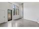 Spacious living area featuring a modern door and a set of windows at 1601 Park Ave # 112, Denver, CO 80218