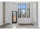 Bright living room featuring a modern door and large windows at 1601 Park Ave # 112, Denver, CO 80218