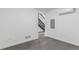 A minimalist room features stairs with a modern design, clean white walls, and sleek flooring at 1601 Park Ave # 112, Denver, CO 80218