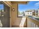 The balcony overlooks the exterior of the condo complex and surrounding landscape at 701 Harlan St # E27, Lakewood, CO 80214