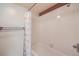 Neutral-colored bathroom with a bathtub and shower combination at 701 Harlan St # E27, Lakewood, CO 80214