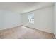 Bright bedroom with carpet floors and a window providing natural light at 701 Harlan St # E27, Lakewood, CO 80214