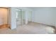 Spacious bedroom with mirrored closet doors offers ample storage at 701 Harlan St # E27, Lakewood, CO 80214