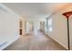 A bright bedroom is empty and ready for decor, with an adjacent bathroom at 701 Harlan St # E27, Lakewood, CO 80214