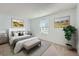 Bright bedroom with natural light, neutral decor, and comfortable furnishings at 701 Harlan St # E27, Lakewood, CO 80214
