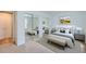 Serene bedroom with mirrored closets, neutral tones, and plenty of natural light at 701 Harlan St # E27, Lakewood, CO 80214