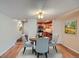Cozy dining room with seating for four, adjacent to the kitchen at 701 Harlan St # E27, Lakewood, CO 80214