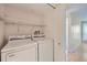Laundry room featuring a full sized washer and dryer at 701 Harlan St # E27, Lakewood, CO 80214