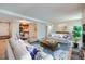 Spacious open-concept living room flowing into the dining area and kitchen at 701 Harlan St # E27, Lakewood, CO 80214