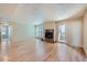 Spacious living room featuring a fire place and sliding door access to a balcony at 701 Harlan St # E27, Lakewood, CO 80214
