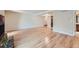 Living room features hardwood floors and a fireplace with ample open space at 701 Harlan St # E27, Lakewood, CO 80214