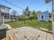 Spacious backyard with a stone patio, grass, wooden fence, and a shed in a residential neighborhood at 835 Knox Ct, Denver, CO 80204