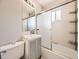 Bright bathroom featuring a vanity, shower and tub, along with a mirrored medicine cabinet and recessed lighting at 835 Knox Ct, Denver, CO 80204