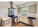 Bright kitchen with modern appliances, neutral cabinets, and a functional layout at 835 Knox Ct, Denver, CO 80204