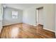 Bright living room featuring hardwood floors, a large window, and neutral paint at 835 Knox Ct, Denver, CO 80204