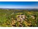 Expansive property featuring a luxurious home, garage, and ample parking at 13007 Kuehster Rd, Littleton, CO 80127