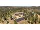 Aerial view of home showing its secluded location and landscaped grounds with mature trees at 13007 Kuehster Rd, Littleton, CO 80127