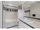 Bathroom with tile surround, bath, and vanity at 13007 Kuehster Rd, Littleton, CO 80127