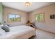 Cozy bedroom with views, bedside table, and carpeted floor at 13007 Kuehster Rd, Littleton, CO 80127