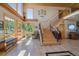 A spacious entryway features a staircase, large windows offering ample natural light, and beautiful tile flooring at 13007 Kuehster Rd, Littleton, CO 80127