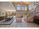 Elegant foyer showcasing beautiful tile work, high ceilings, and large windows that flood the space with natural light at 13007 Kuehster Rd, Littleton, CO 80127