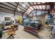 Large equipment barn interior with truck, tractor, and machinery at 13007 Kuehster Rd, Littleton, CO 80127