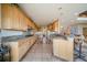 A spacious kitchen with ample counter space, light wood cabinets, and stainless steel appliances at 13007 Kuehster Rd, Littleton, CO 80127