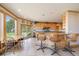 A modern kitchen features granite countertops, a breakfast bar, stainless steel appliances, and natural light at 13007 Kuehster Rd, Littleton, CO 80127