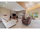 Cozy living room featuring wooden accents, plush seating, and stunning outdoor views at 13007 Kuehster Rd, Littleton, CO 80127