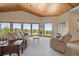 Comfortable living room with scenic views, wooden ceiling, and plush seating at 13007 Kuehster Rd, Littleton, CO 80127