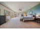 Spacious main bedroom features scenic windows, carpeted floors, a ceiling fan, and a walkout at 13007 Kuehster Rd, Littleton, CO 80127