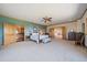 Spacious main bedroom features a walkout to a bathroom, and views of the balcony and main living space at 13007 Kuehster Rd, Littleton, CO 80127