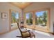 Bright sitting area offers scenic views with ample natural light and comfortable seating at 13007 Kuehster Rd, Littleton, CO 80127