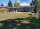 Large fenced backyard with a patio, grill, and mature trees provides a private outdoor space at 7123 Winona Ct, Westminster, CO 80030