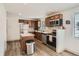This kitchen features stainless steel appliances, wood cabinets, and modern design at 7123 Winona Ct, Westminster, CO 80030