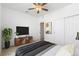 Serene bedroom with ceiling fan, closet, and stylish decor at 5319 Warrior St, Frederick, CO 80504