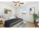 Cozy bedroom with plush carpeting, ceiling fan, natural light, and contemporary decor at 5319 Warrior St, Frederick, CO 80504