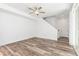 Bright living room with wood floors and an open staircase at 5319 Warrior St, Frederick, CO 80504