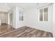 Bright living room featuring hardwood floors and an adjacent sliding glass door that provides tons of natural light at 5319 Warrior St, Frederick, CO 80504