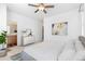 Airy main bedroom with white walls, ceiling fan, and stylish decor at 5319 Warrior St, Frederick, CO 80504
