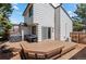 Private backyard featuring a spacious deck, an outdoor table and barbeque for outdoor entertaining at 7633 Gray Way, Arvada, CO 80003