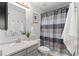 Well-lit bathroom featuring modern fixtures, and tiled shower at 7633 Gray Way, Arvada, CO 80003