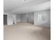 Unfinished basement is spacious with gray carpet, gray walls, and a small window at 2149 Peralta Loop, Castle Rock, CO 80104