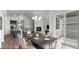 Dining area with a modern table set, open to the kitchen and living area, and access to a patio at 2149 Peralta Loop, Castle Rock, CO 80104