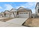 Charming single-Gathering home features stone accents, covered porch, and attached two car garage at 2149 Peralta Loop, Castle Rock, CO 80104
